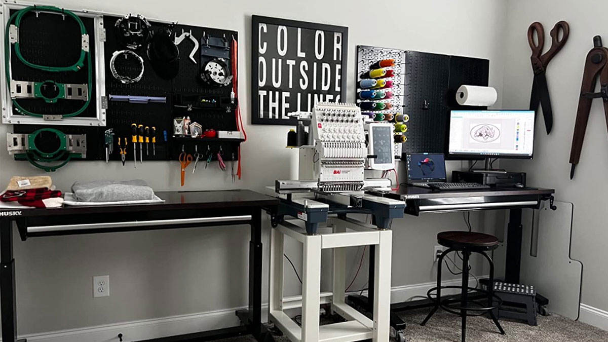 A fully equipped embroidery workspace.
